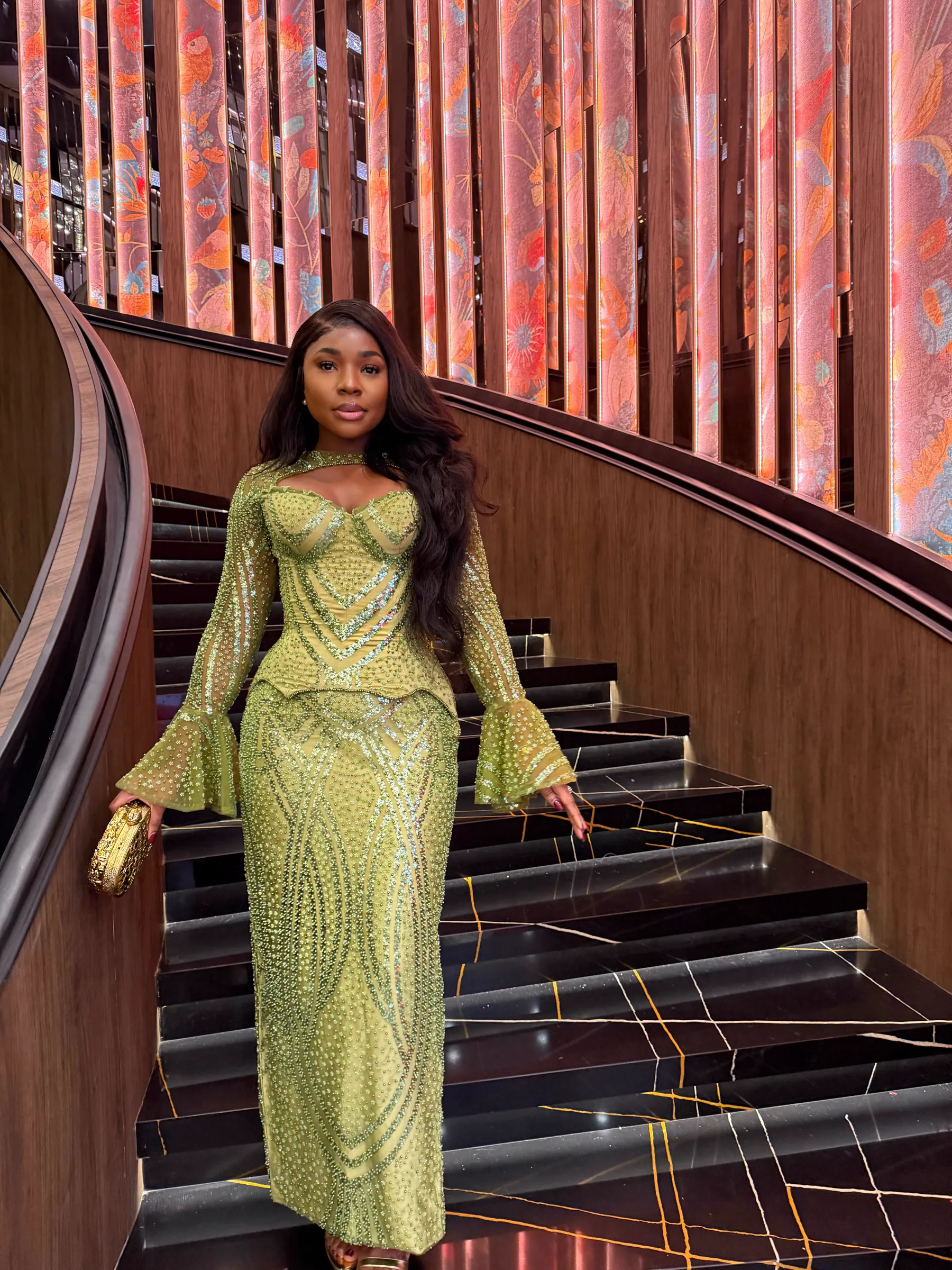 Client wearing a Jiofit Aso Ebi ensemble at a Lagos celebration