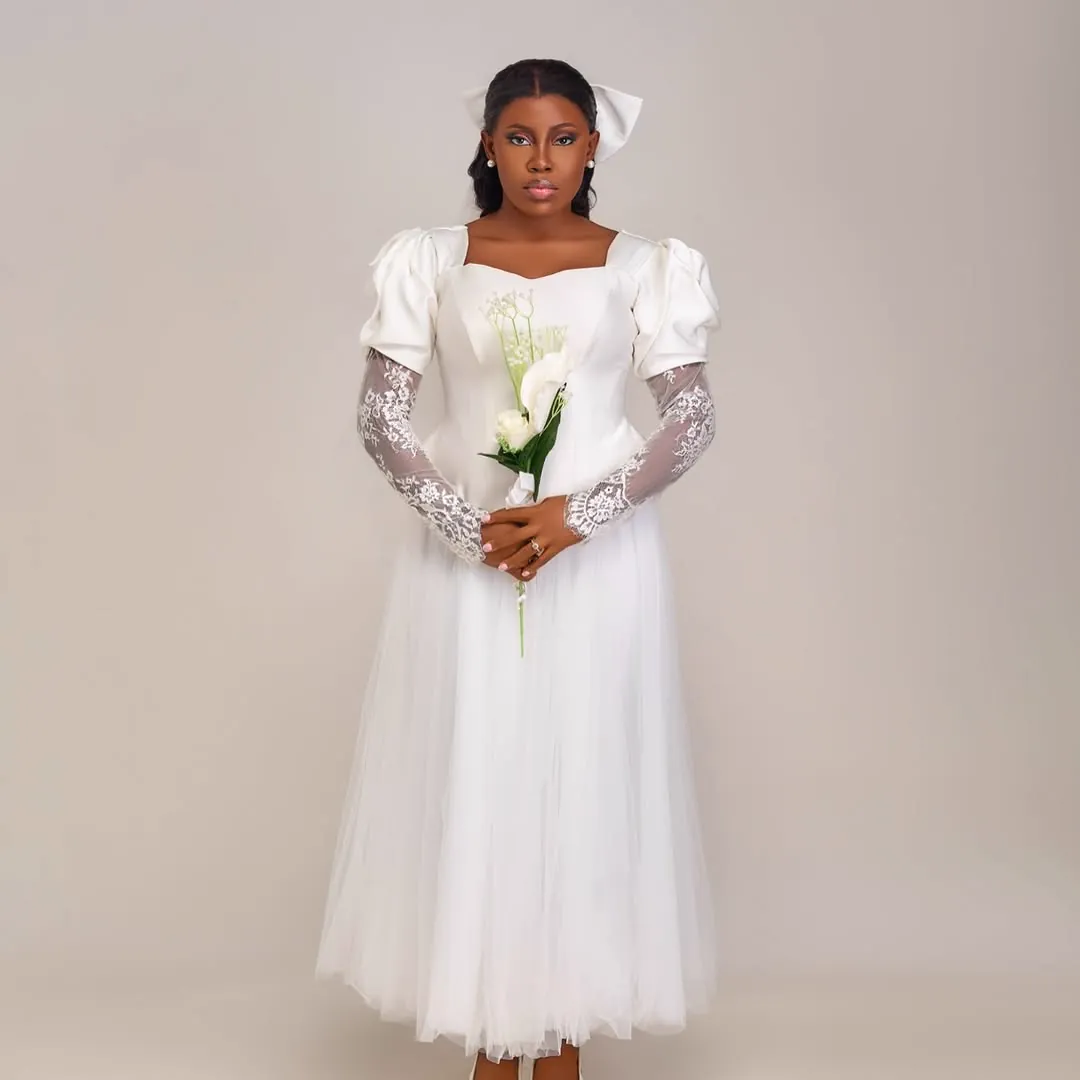 Jiofit bridal look with a corseted bodice and floral appliqué