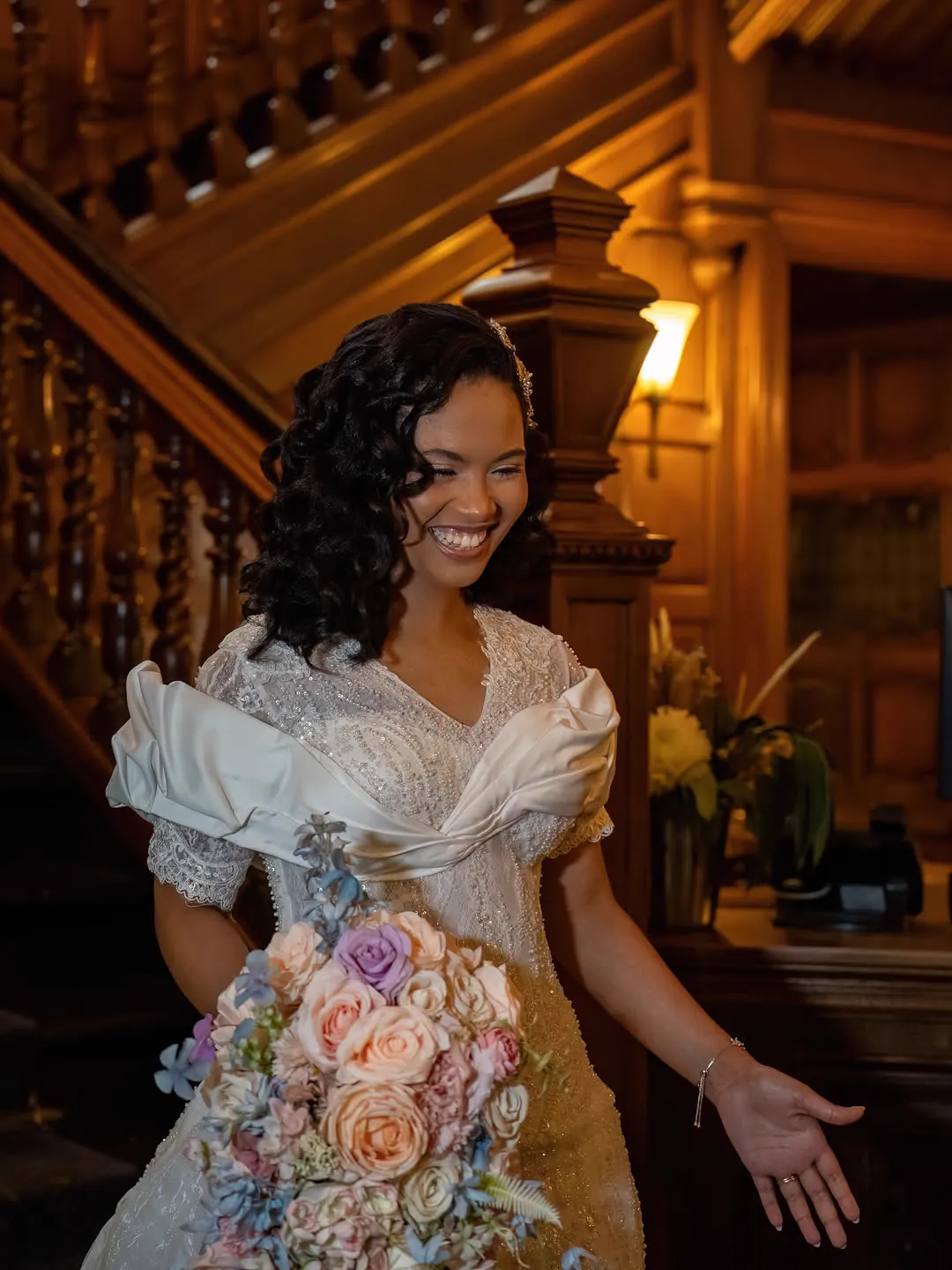 Full-length Jiofit bridal gown with a beaded bodice and sweeping train