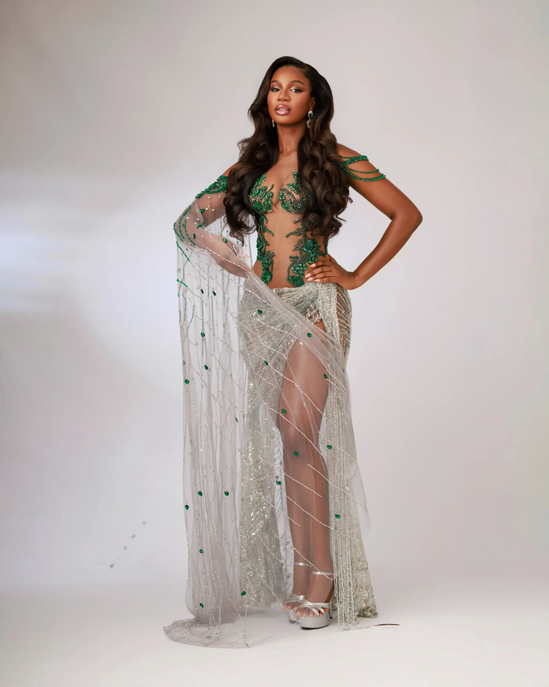 Full-length view of the Jiofit Miss Universe Nigeria gown with the cape draped to the floor